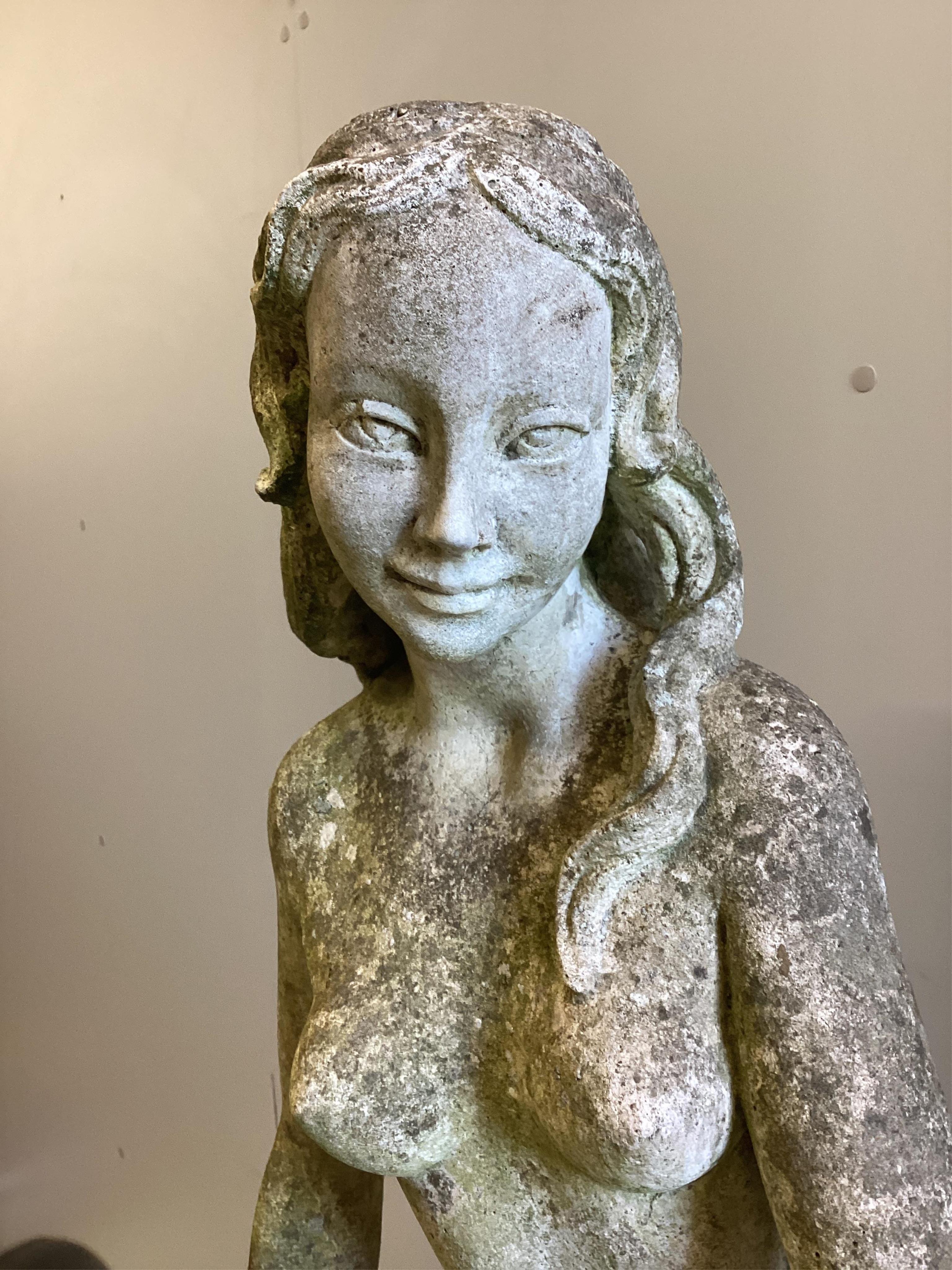 A reconstituted stone garden statue, height 140cm. Condition fair.